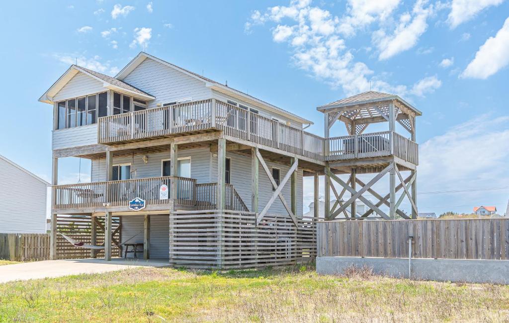 a house with a gazebo on the side of it at Carolina Kai, Kitty Hawk MP 3, 275 Yds to Beach, Ocean View, Pool, Hot Tub, Flex Stays in Kitty Hawk