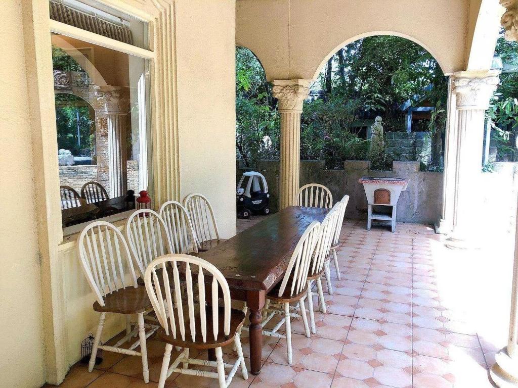 a wooden table and chairs on a patio at Xin Yuan My Dream Castle in Dongshan