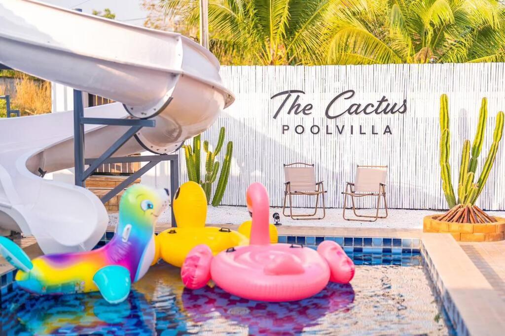 a pool with some toys in the water at The Cactus Pool Villa Pattaya in Ban Huai Yai