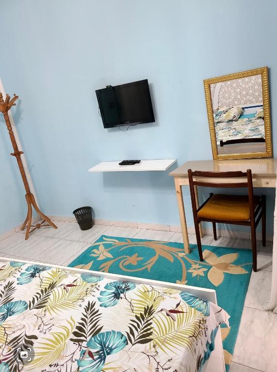 TV a/nebo společenská místnost v ubytování Maison D'hôte Dar Saida