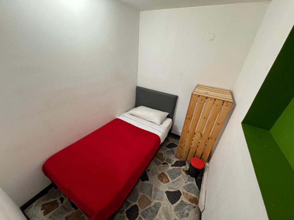 Postel nebo postele na pokoji v ubytování Hostel Bogotá Normandia Tu sitio