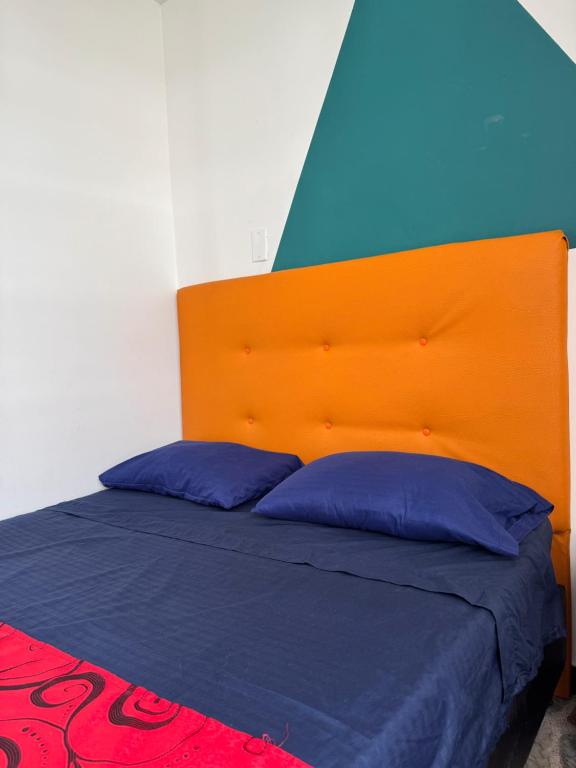 Postel nebo postele na pokoji v ubytování Hostel Bogotá Normandia Tu sitio