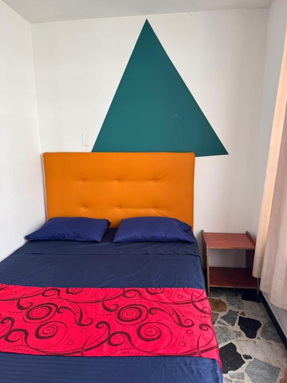 Postel nebo postele na pokoji v ubytování Hostel Bogotá Normandia Tu sitio