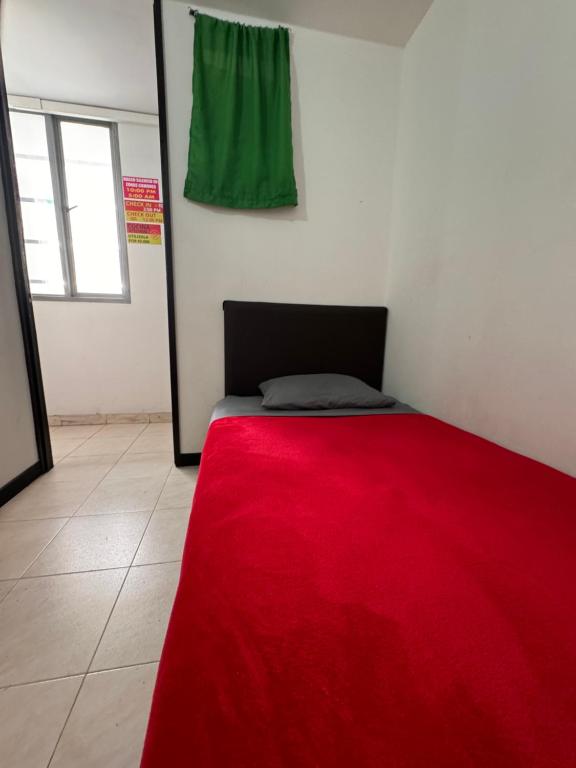 Postel nebo postele na pokoji v ubytování Hostel Bogotá Normandia Tu sitio
