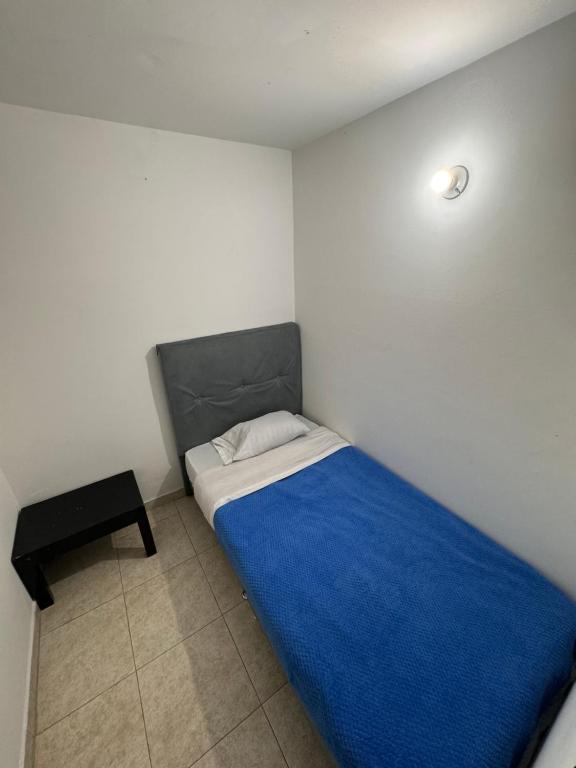 Postel nebo postele na pokoji v ubytování Hostel Bogotá Normandia Tu sitio