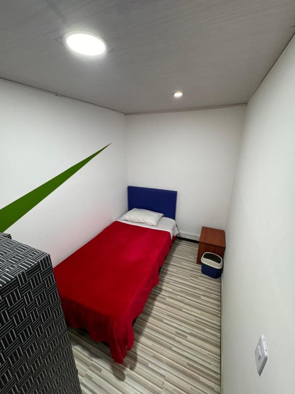 Postel nebo postele na pokoji v ubytování Hostel Bogotá Normandia Tu sitio