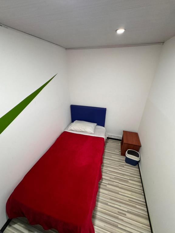 Postel nebo postele na pokoji v ubytování Hostel Bogotá Normandia Tu sitio