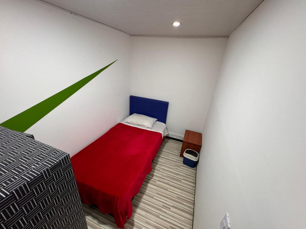 Postel nebo postele na pokoji v ubytování Hostel Bogotá Normandia Tu sitio