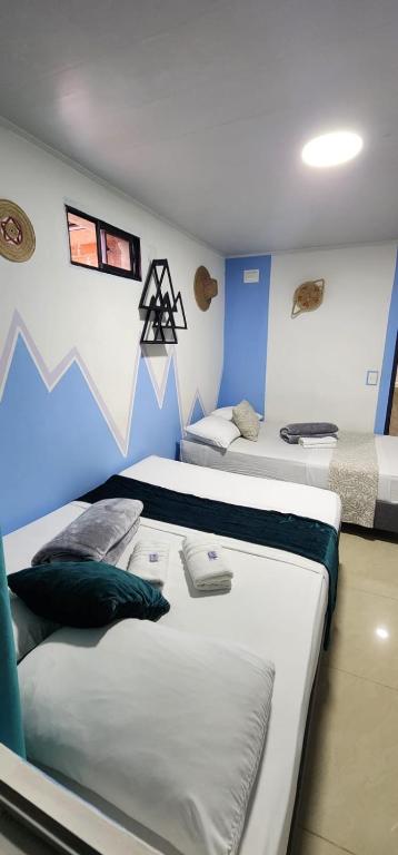 Postel nebo postele na pokoji v ubytování Aparta Hotel la 80 Estadio