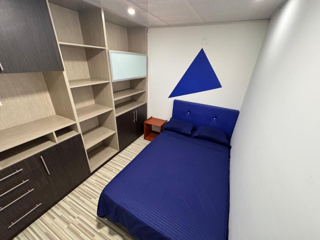Postel nebo postele na pokoji v ubytování Hostel Bogotá Normandia Tu sitio