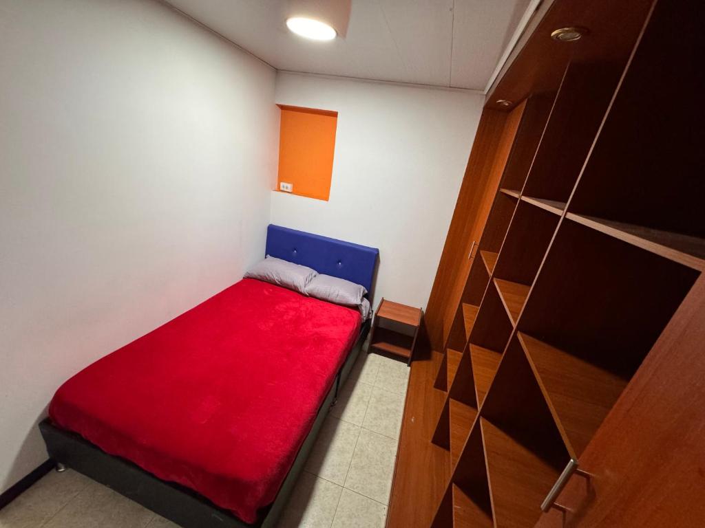 Postel nebo postele na pokoji v ubytování Hostel Bogotá Normandia Tu sitio