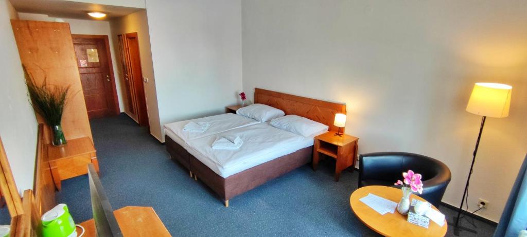 Rúm í herbergi á Hotel Magnolia