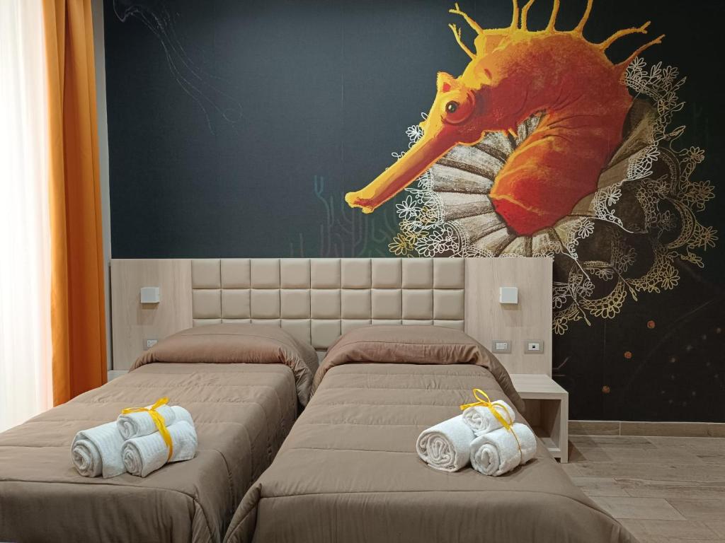 Postel nebo postele na pokoji v ubytování Schilizzi Hotel