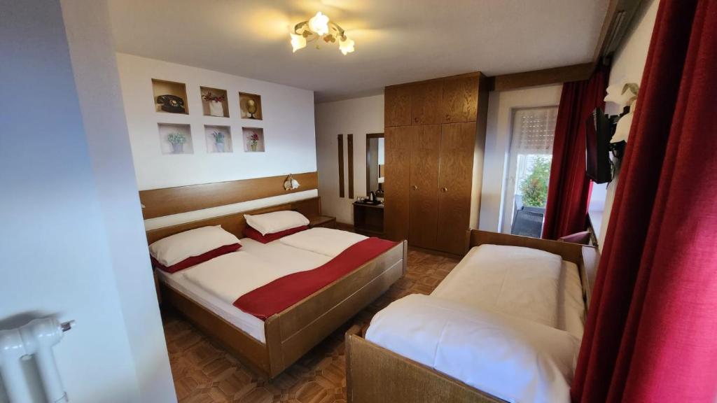 Postel nebo postele na pokoji v ubytování Inter Hotel B&B