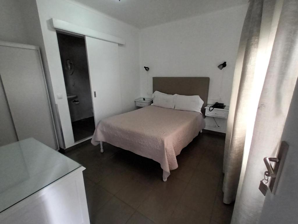 Postel nebo postele na pokoji v ubytování Hotel Branco I