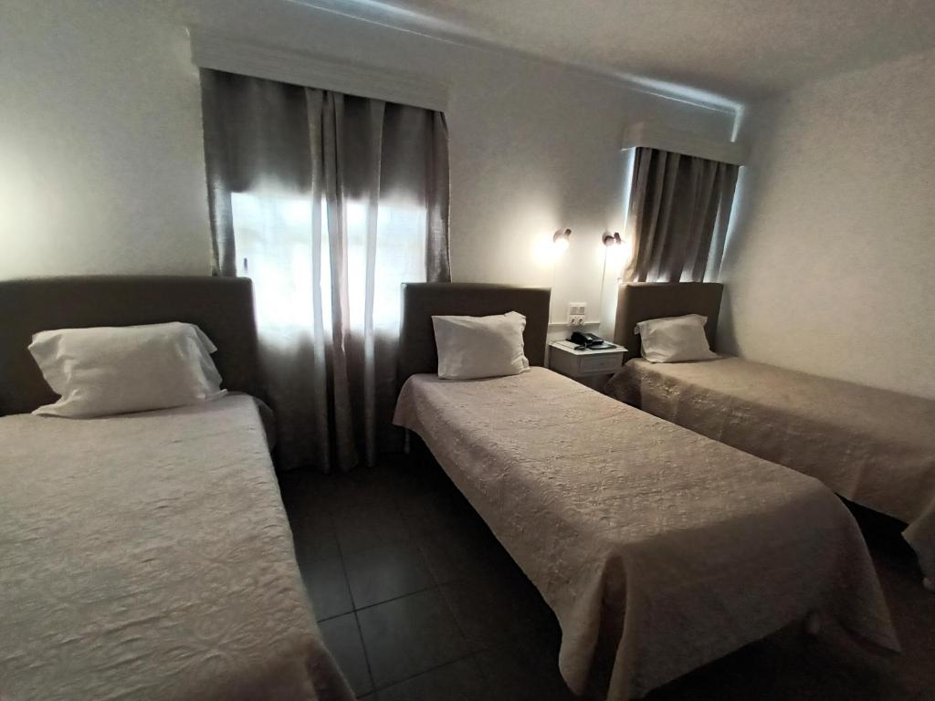 Postel nebo postele na pokoji v ubytování Hotel Branco I
