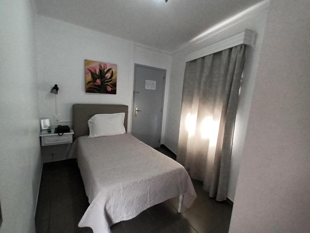 Postel nebo postele na pokoji v ubytování Hotel Branco I