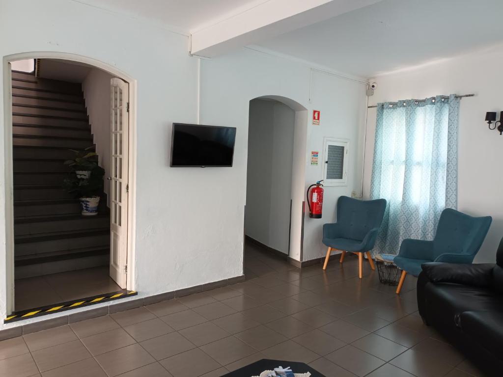 TV a/nebo společenská místnost v ubytování Hotel Branco I