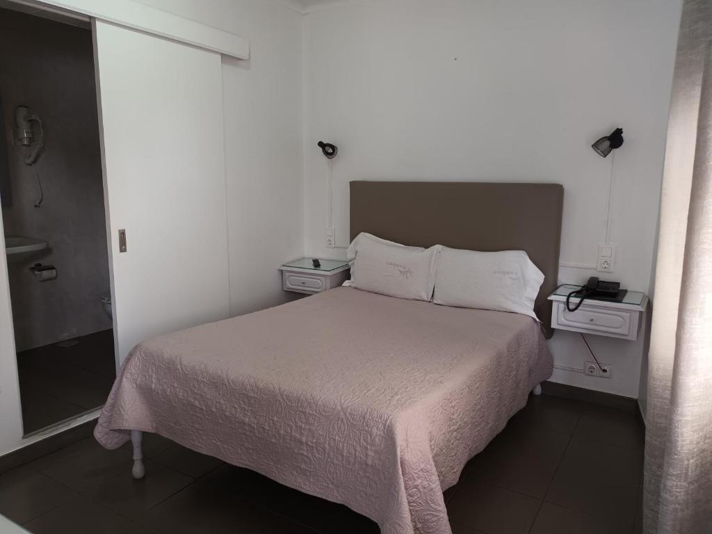 Postel nebo postele na pokoji v ubytování Hotel Branco I