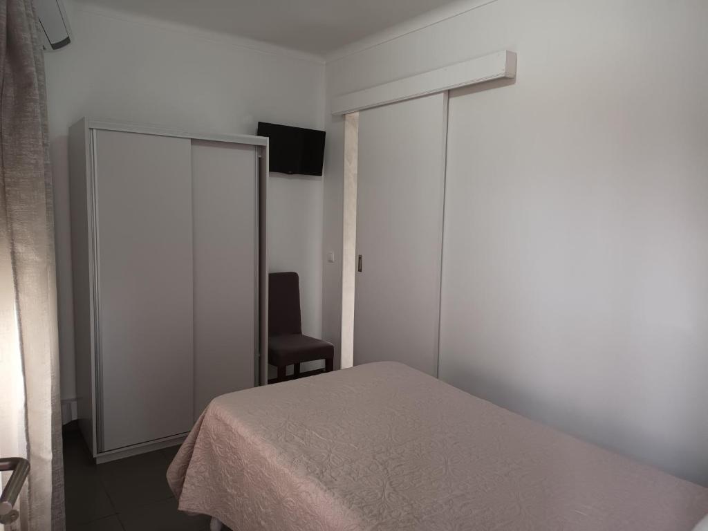 Postel nebo postele na pokoji v ubytování Hotel Branco I