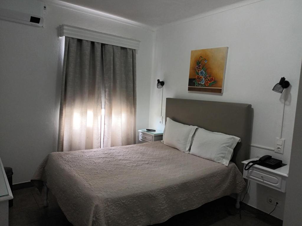 Postel nebo postele na pokoji v ubytování Hotel Branco I
