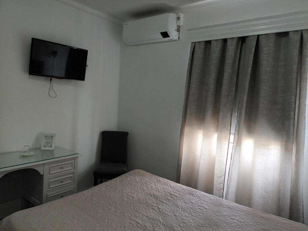 TV a/nebo společenská místnost v ubytování Hotel Branco I