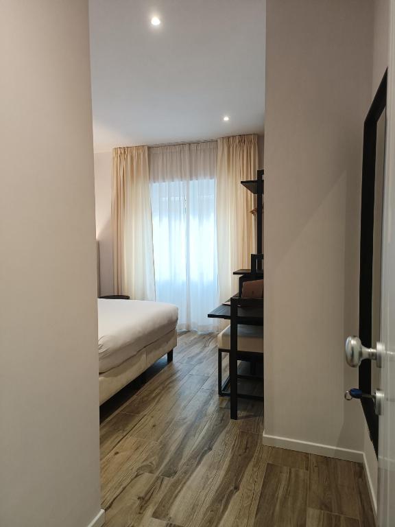 Postel nebo postele na pokoji v ubytování Romi Suite