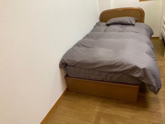 Postel nebo postele na pokoji v ubytování Sky Tree INN Ⅱ（晴樹宿Ⅱ）