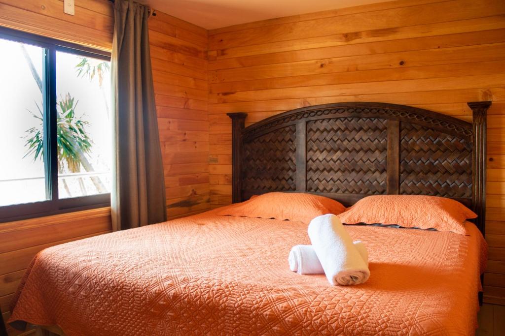 En eller flere senge i et værelse på San José del Pacífico Familiar Camino al Cielo