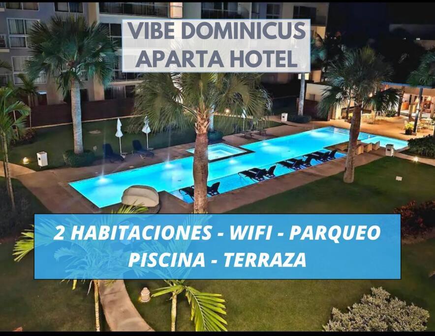 un cartello per un hotel con piscina di Blue Coast Apartment - Vibe Dominicus a La Laguna