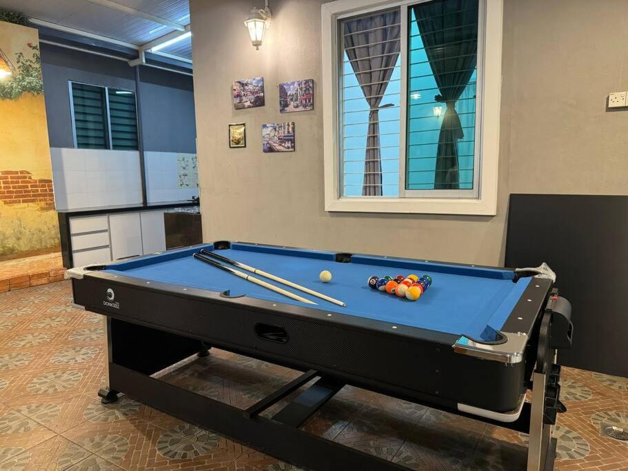 a pool table with balls on top of it at Queen’s Home +Snooker+darts+air hockey in Alor Setar