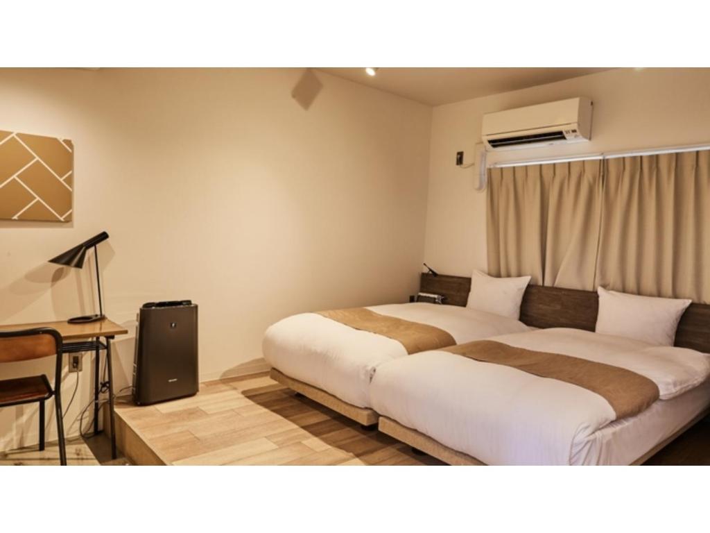 מיטה או מיטות בחדר ב-River Side Arashiyama - Vacation STAY 86031v