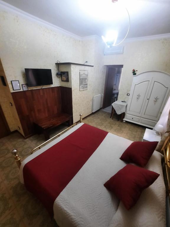 Postel nebo postele na pokoji v ubytování Hotel Alexis