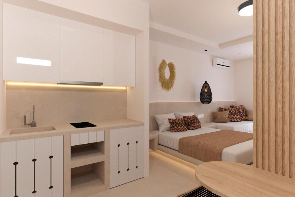 a bedroom with a bed and a desk and a table at Likio Studios in Batsi