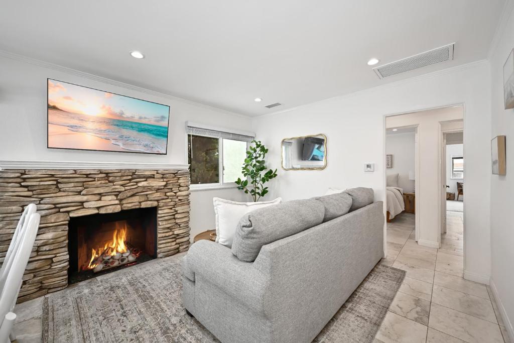 a living room with a couch and a fireplace at 1313 S Coast Hwy in Laguna Beach