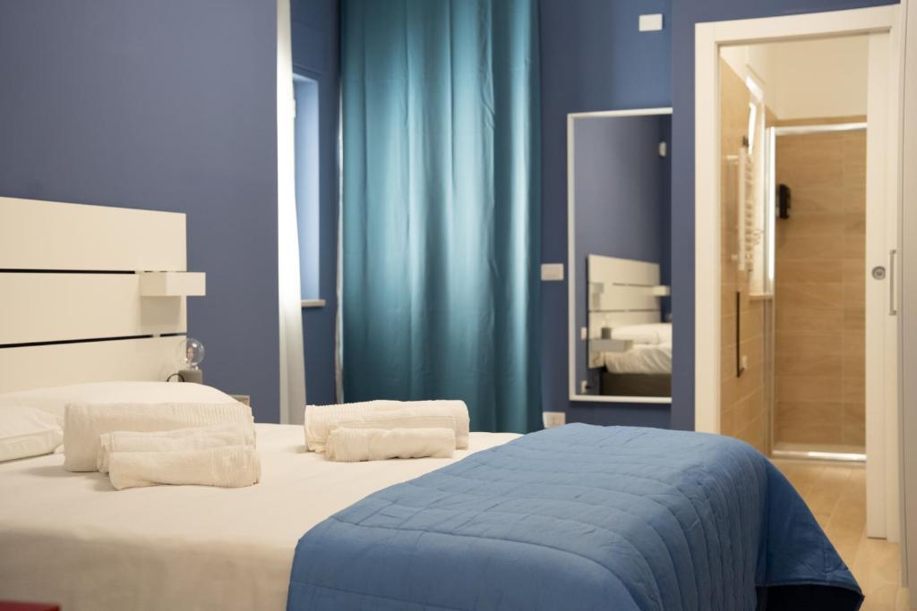 Postel nebo postele na pokoji v ubytování PALAZZO ENNIO