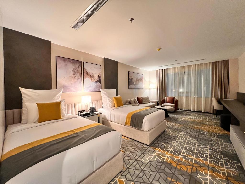 Postel nebo postele na pokoji v ubytování Enala Hotel- Umluj