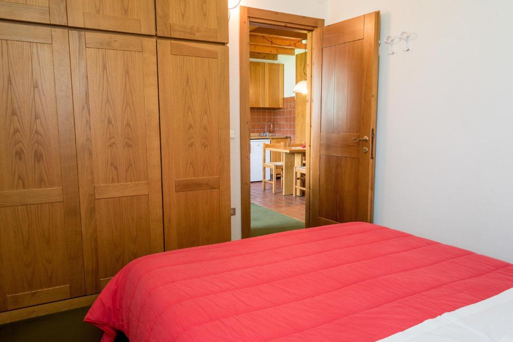 A bed or beds in a room at Residence Des Alpes