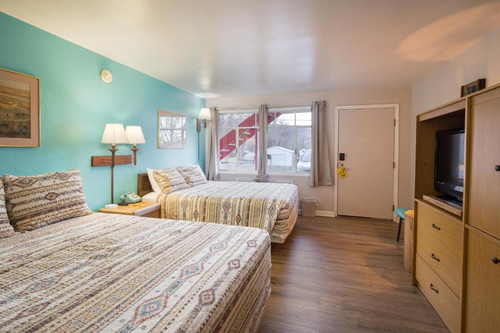 Postel nebo postele na pokoji v ubytování Apache Motel