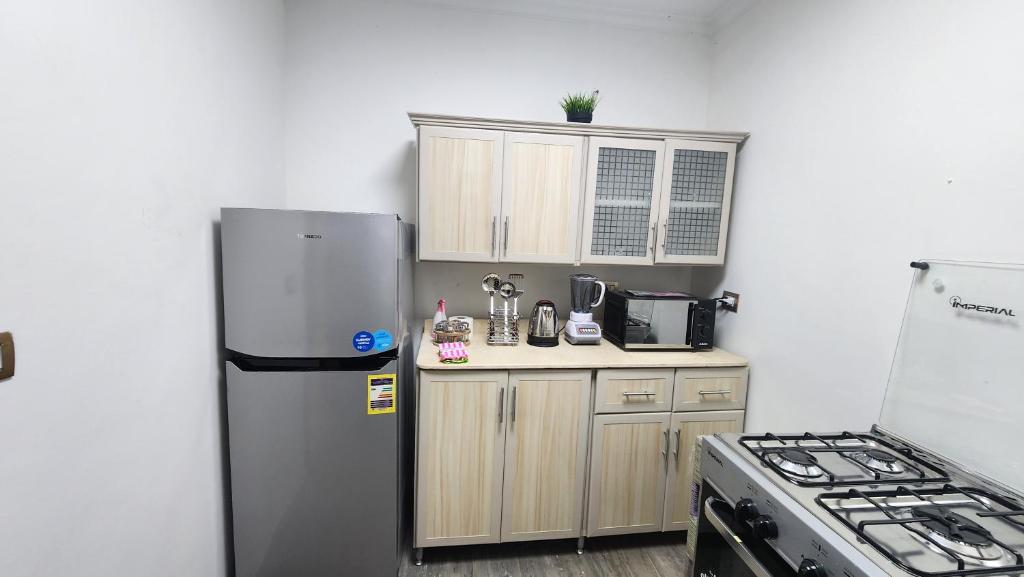 Kuchyň nebo kuchyňský kout v ubytování Madinaty apartment 1 شقة فندقية مفروشة سوبر لوكس في مدينتي