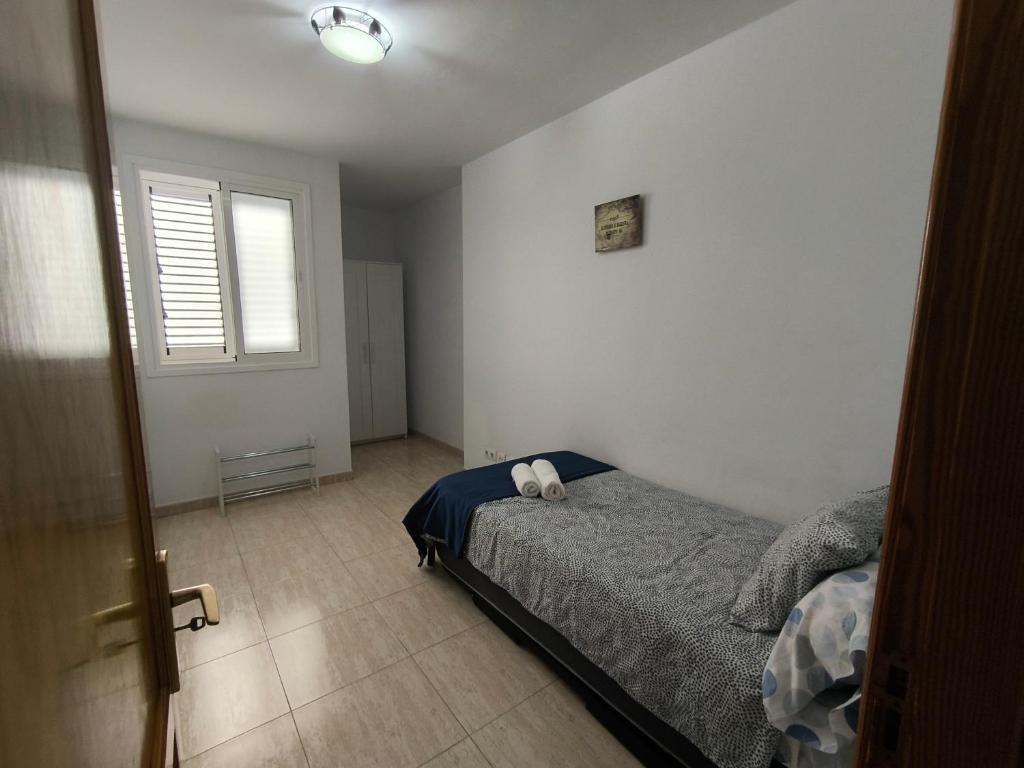 Postel nebo postele na pokoji v ubytování AR Home - Apartamento de 3 dormitorios con ascensor en Las Huesas, Telde
