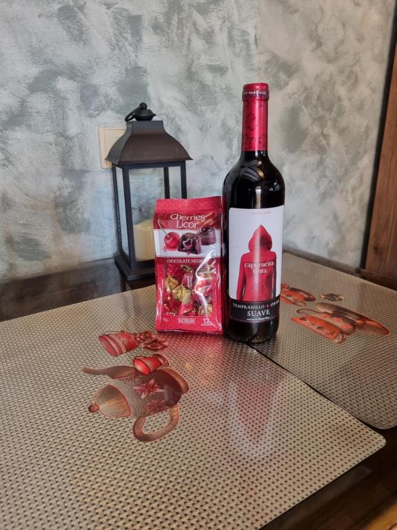 a bottle of wine sitting on top of a table at CASA PABLITO in San Bartolomé de Tirajana