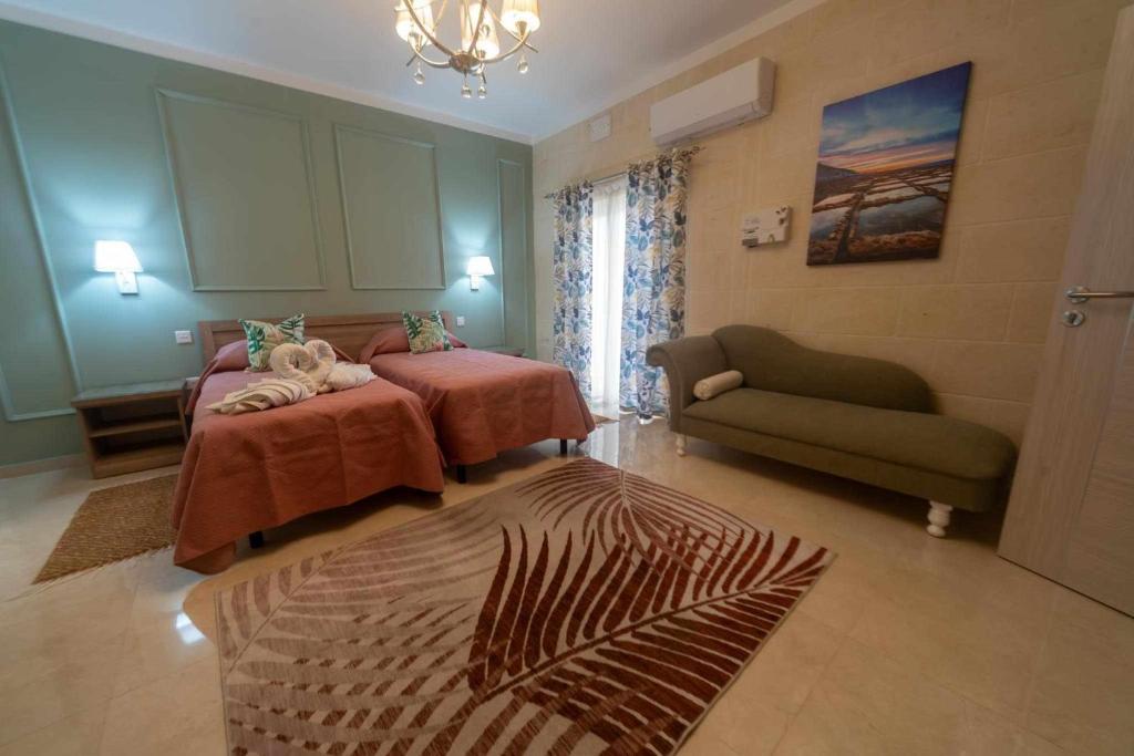 Postel nebo postele na pokoji v ubytování Casa Maria Pia