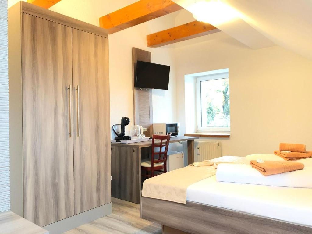Postel nebo postele na pokoji v ubytování Pension Goldenes Vogtland