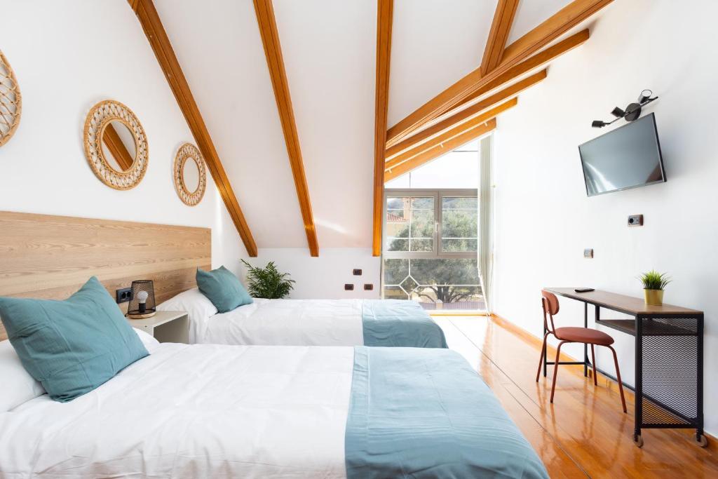 Postel nebo postele na pokoji v ubytování Casa Lali Habitación 3