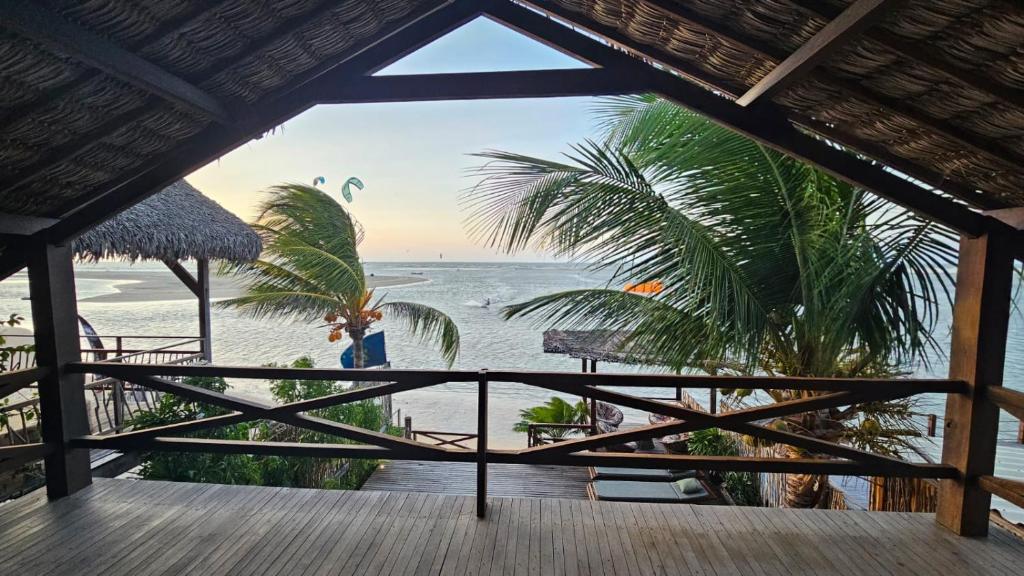 a view of the beach from a resort balcony at TATAJUBA KITE HOUSE in Tatajuba