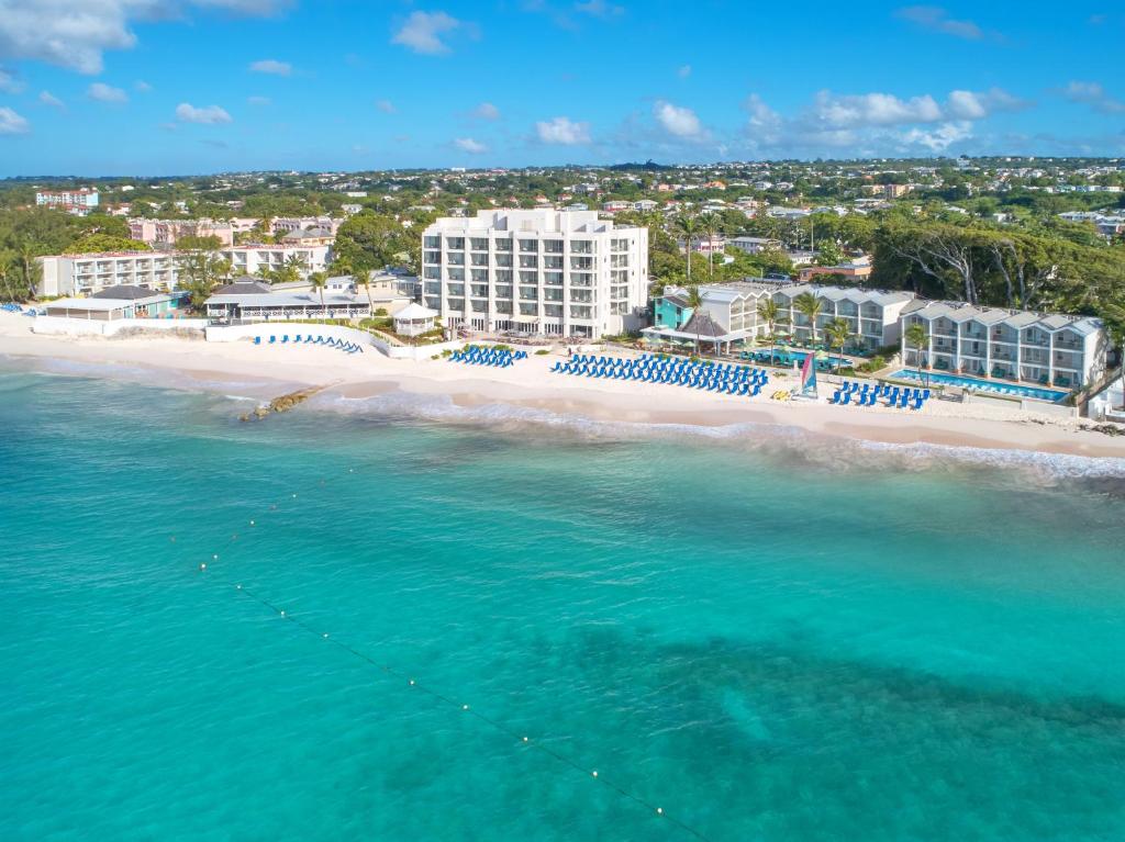 an aerial view of a beach with umbrellas at Sea Breeze Beach House All Inclusive by Ocean Hotels in Christ Church