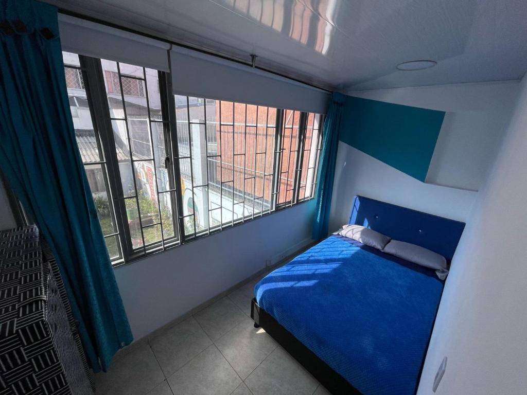 Postel nebo postele na pokoji v ubytování Hostel Bogotá Normandia Tu sitio