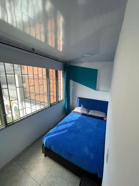 Postel nebo postele na pokoji v ubytování Hostel Bogotá Normandia Tu sitio