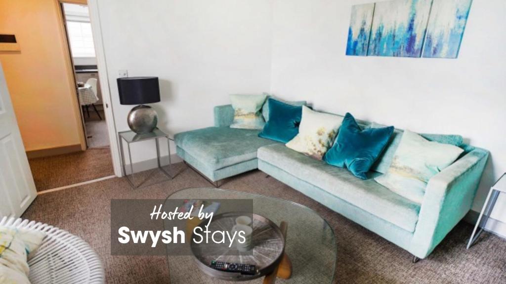 a living room with a couch and a table at Franks, Cowes - Sleeps 4 - 2 Bed - 2 Bath - Central Location in Cowes